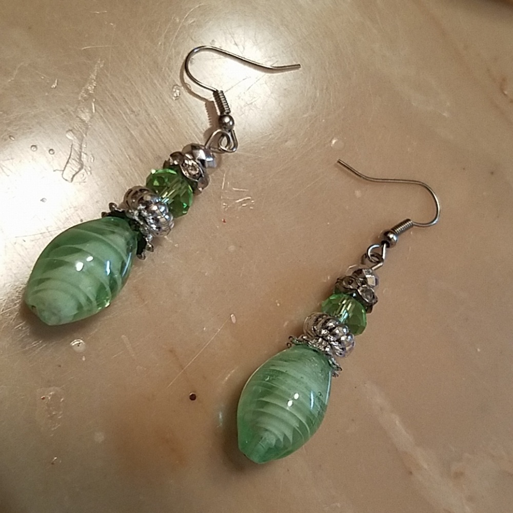 NWOT Pierced light teal earrings